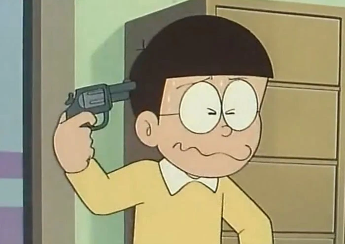 Nobita pointing a gun to his head meme